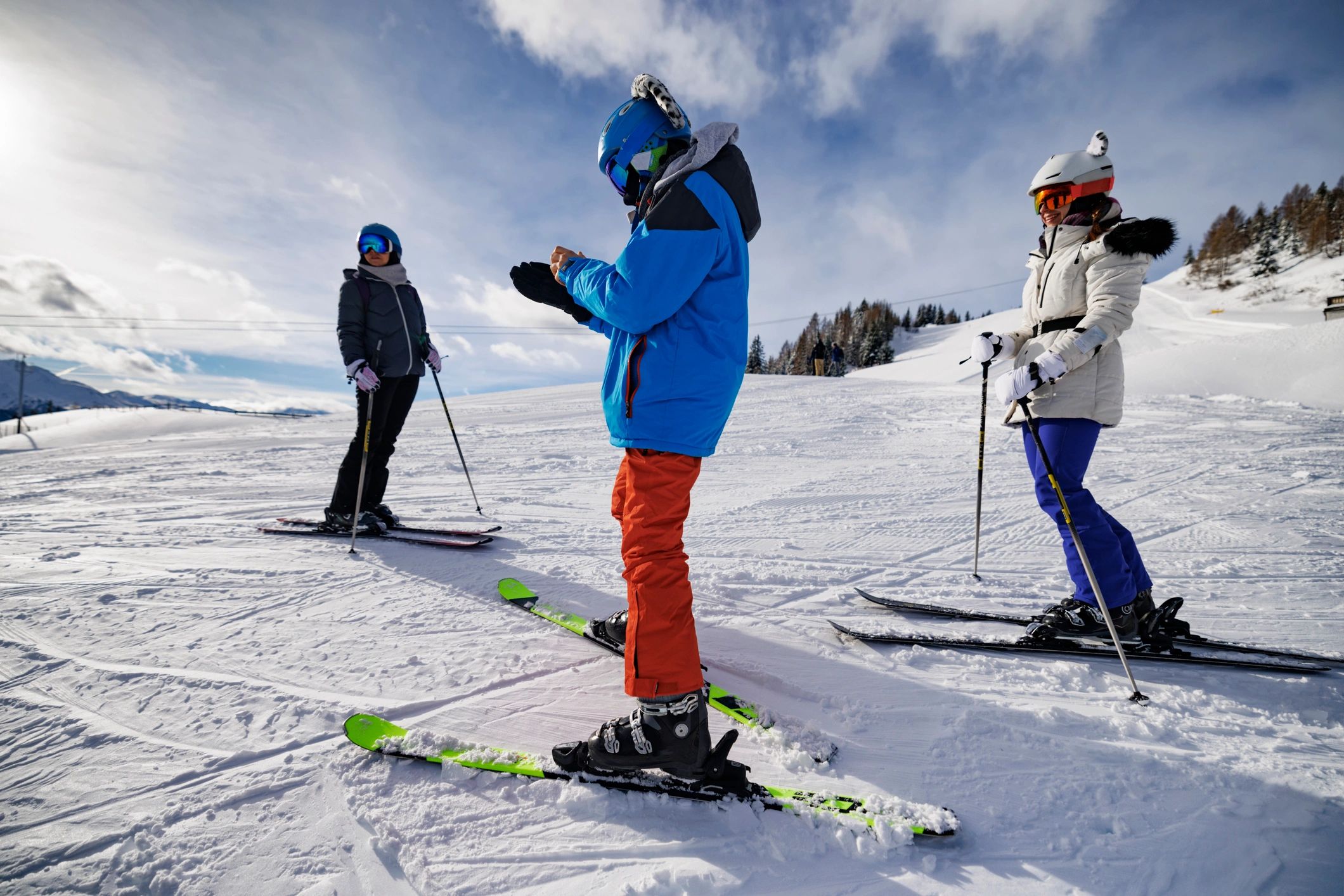 Family skiing together on a sunny winter day