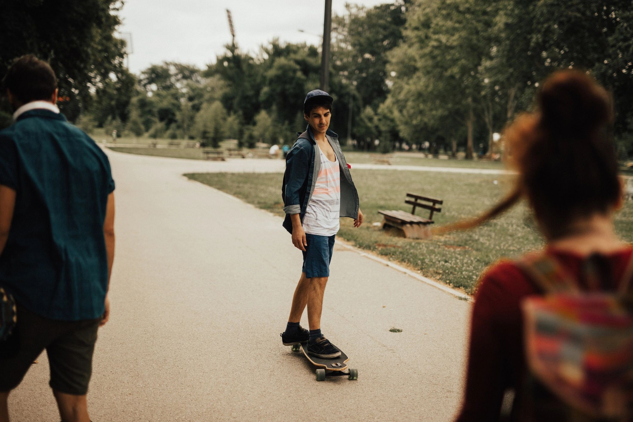 Kids practicing skateboarding at a public park